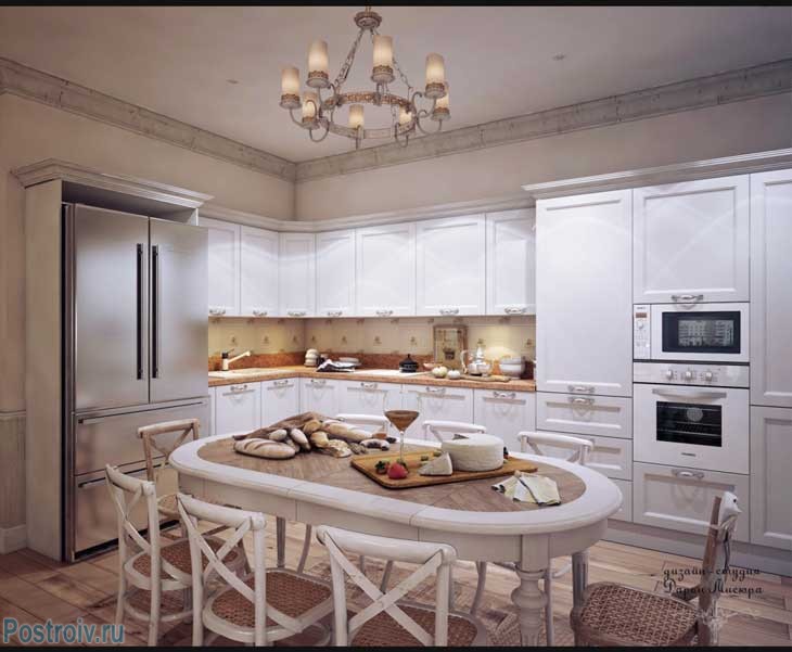Большая угловая белая кухня с овальным столом для всей семьи. Фото Большая угловая белая кухня с овальным столом для всей семьи. Фото