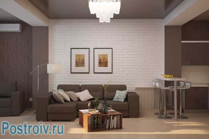 Стена гостиной отделана декоративным кирпичом. Также присутствуют модульные картины - Фото Стена гостиной отделана декоративным кирпичом. Также присутствуют модульные картины - Фото