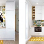 Небольшая угловая кухня в однокомнатной квартире после ремонта. Со встроенной бытовой техникой - Фото