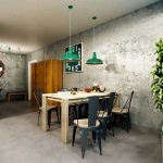 Обеденная зона. Прямоугольный светлый стол и черные стулья. Зеленые светильники. Фото