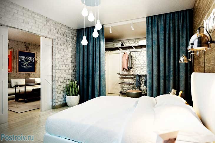 Интерьер белой спальни. Белый кирпич на стенах. Фото