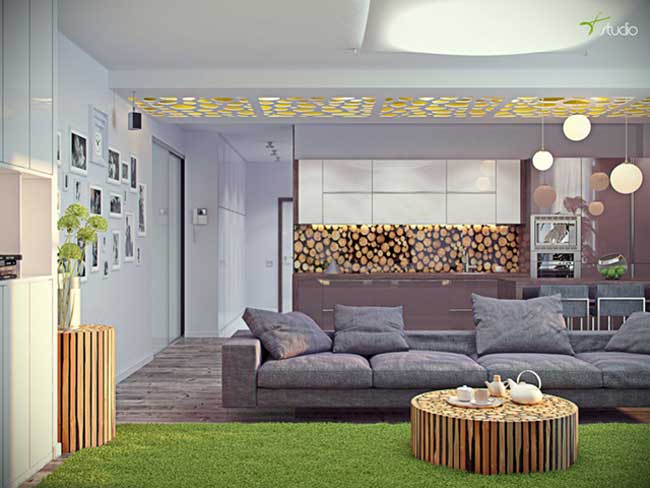 Гостиная совмещенная с кухней в светлых тонах с большим диваном