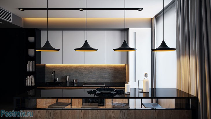 Черные современные светильники над барной стойкой. Фото